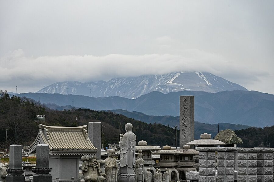 Odani Castle ruins on the mountain ridge north of the Anegawa with Mount Ibuki visible in the distance