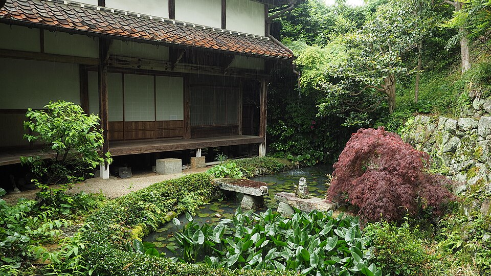 Raikyu-ji temple garden in Takahashi showing the clipped karikomi azalea hedges the tsuru-shima crane island and kame-shima tortoise island in the karesansui dry landscape design by Kobori Enshu