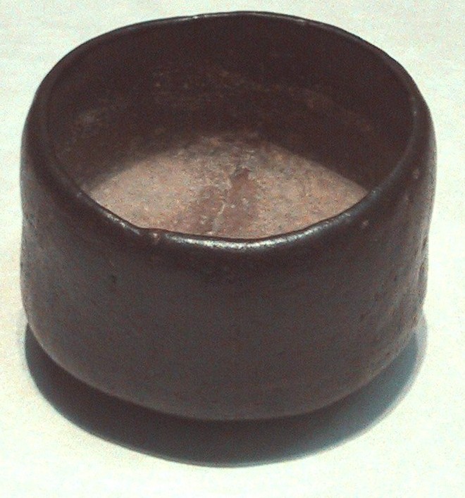 A classic black Raku chawan tea bowl of the type Sen no Rikyu commissioned from Chojiro for his wabi-cha ceremonies