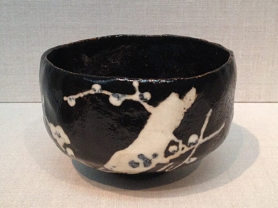 An Edo period raku-ware tea bowl with plum blossom design showing how the Rikyu-Chojiro tradition continued through successive generations