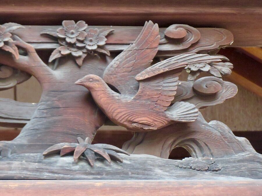 Ranma transom with carved doves motif at the main hall of Itahato-jinja shrine showing religious ranma variant