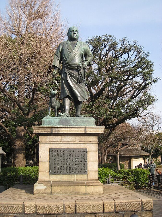 Statue of Saigo Takamori in kimono walking with his dog Tsun at Ueno Park Tokyo Takamura Koun 1898 bronze