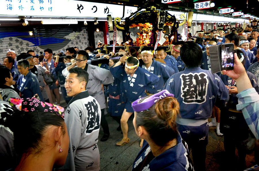 Sanja Matsuri bearers shouldering a portable shrine in Asakusa