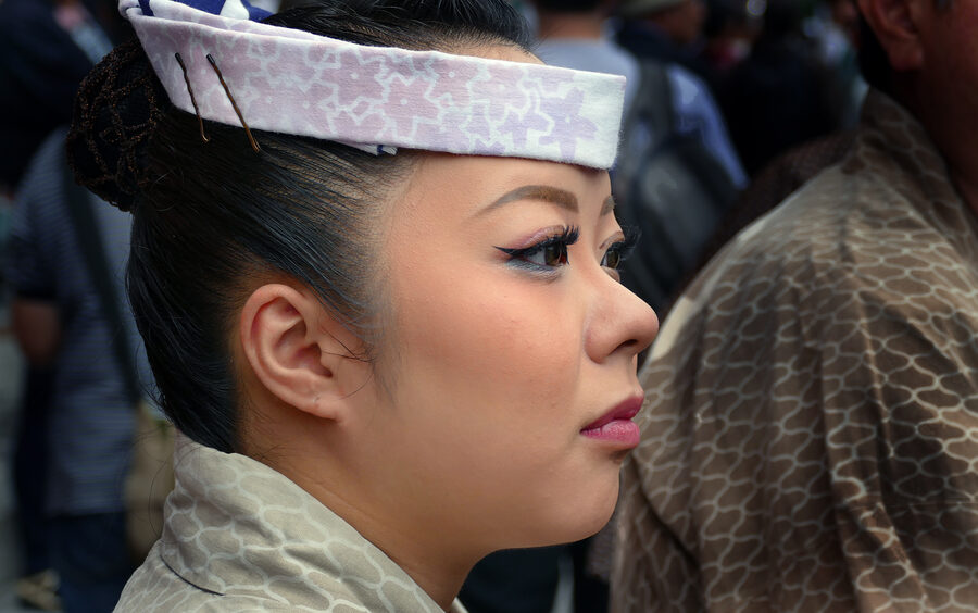 Sanja Matsuri participant in traditional happi and fundoshi attire in Asakusa