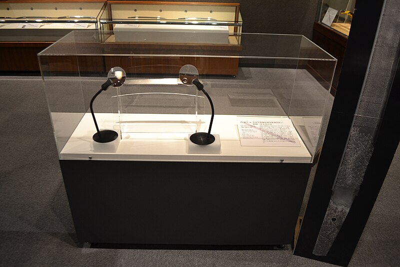 Interior of the Seki Sword Tradition Museum showing the reconstructed traditional smithy with a charcoal forge low wooden floor anvils and tool racks