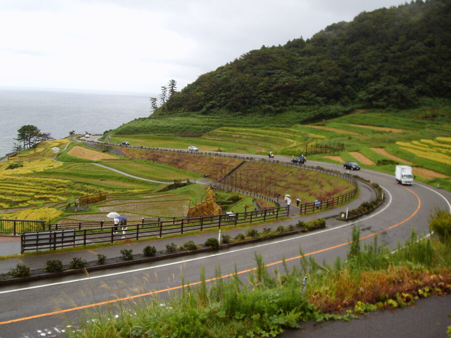 National Route 249 winding past the Senmaida paddies with the Sea of Japan