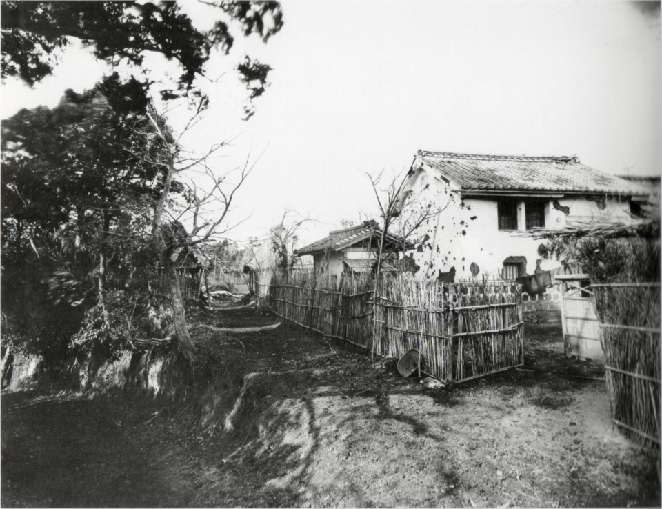 Tomishige Rihei photograph around 1880 of a Tabaruzaka storehouse riddled with bullet holes from the 1877 eight-day battle