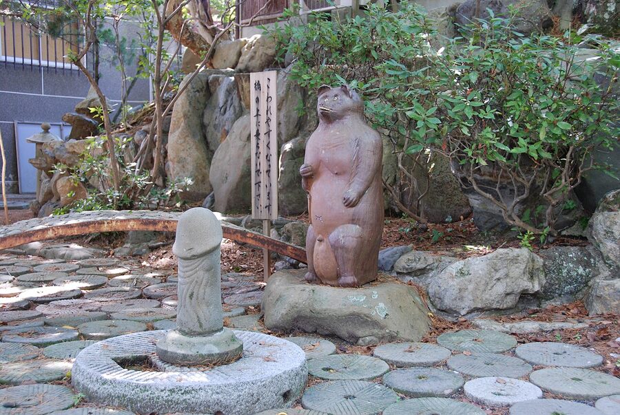Wooden fertility symbols on display at Taga Shrine in Uwajima