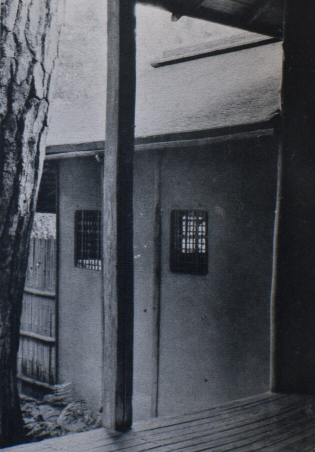 Detail view of the Tai-an National Treasure tea house at Myoki-an temple showing the weathered wood and mud-plastered walls