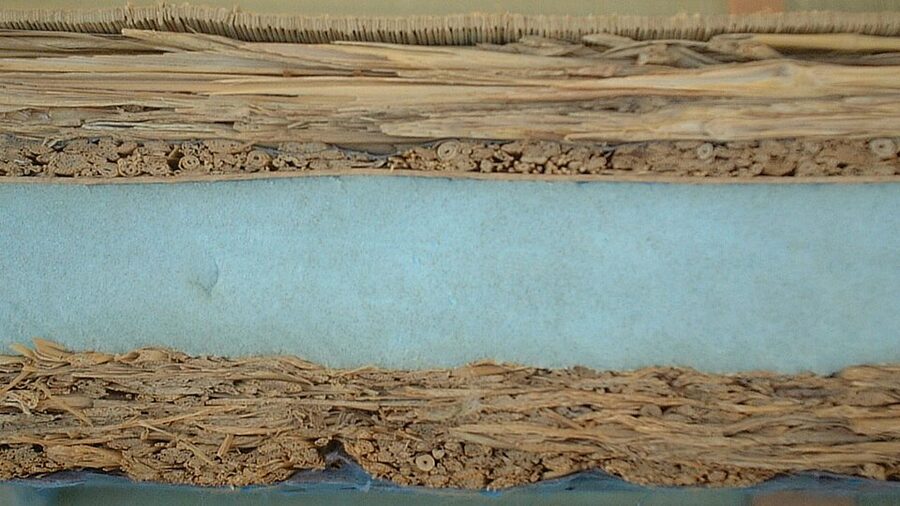 Cross-sectional view of a tatami mat showing the toko straw core the igusa rush facing and the cloth edge binding