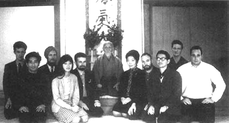 Morihei Ueshiba surrounded by foreign students at his birthday party at Tokyo Aikikai Hombu Dojo, 1967