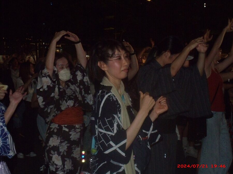 Dancers in yukata performing Bon Odori at the 2024 Umekita festival in Osaka