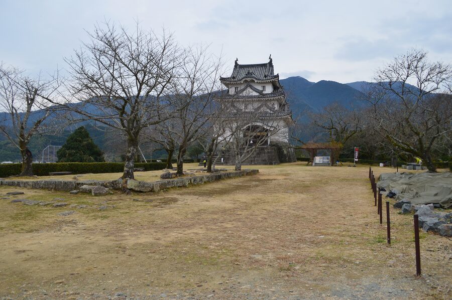 View of the honmaru bailey showing the three-storey Uwajima Castle tenshu above the stone walls