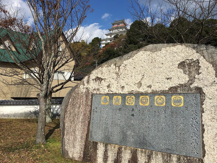 Close exterior shot of the Uwajima Castle tenshu showing its three storeys and gables