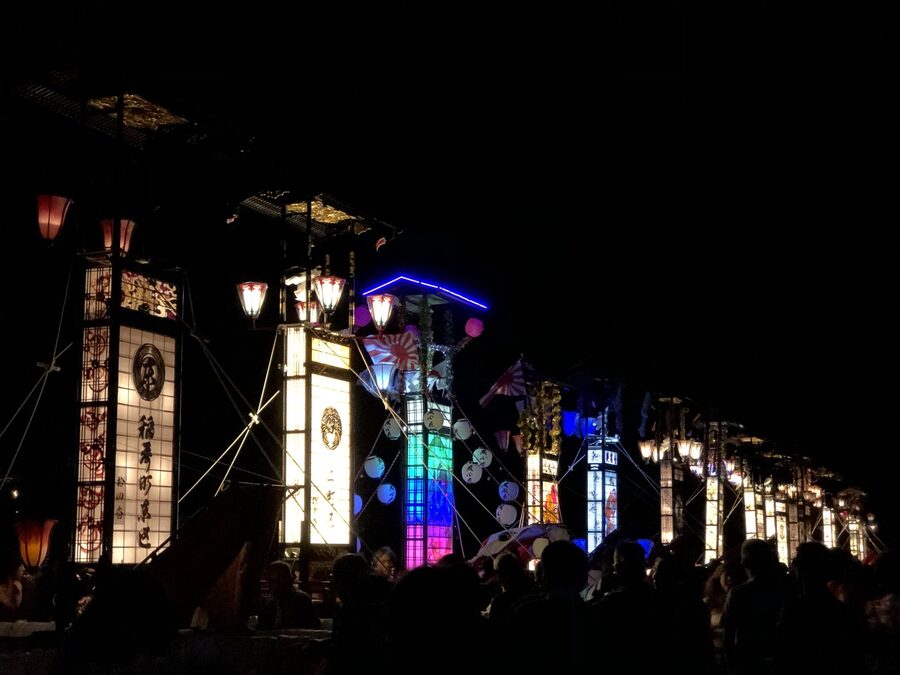 Towering Kiriko lanterns lit at night during the Wajima Taisai festival
