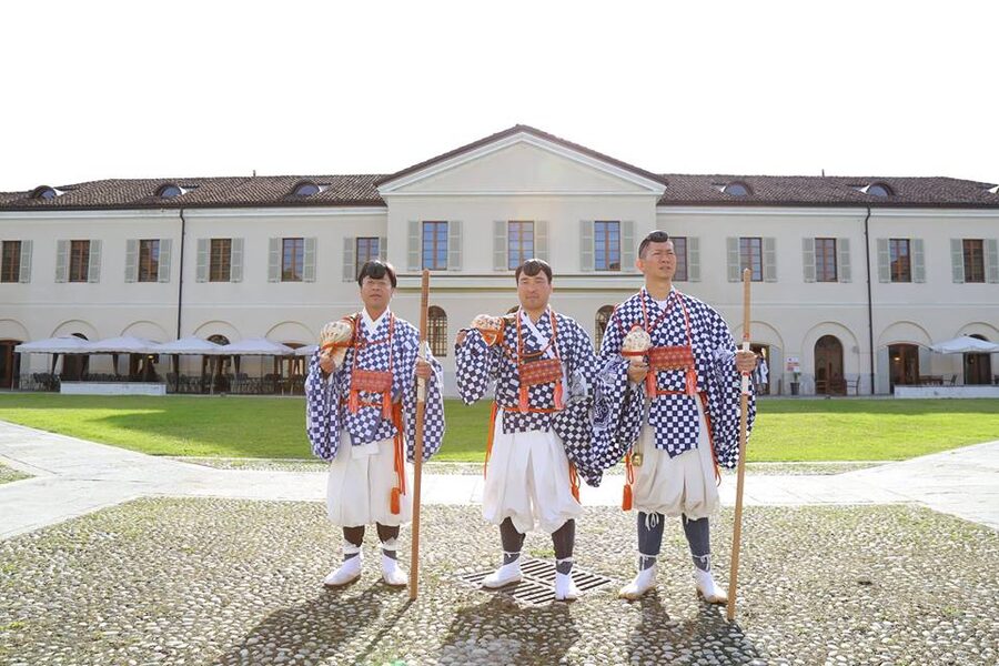 Yamabushi ceremonial outfit hanging on display, white robe and conch horn